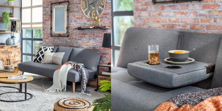 Living estilo industrial con futón funcional gris con respaldo plegable para apoyar vasos y comida