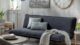 Cómo decorar un living pequeño con un futón negro o marrón